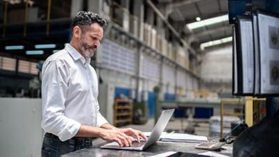 A man looking at a laptop